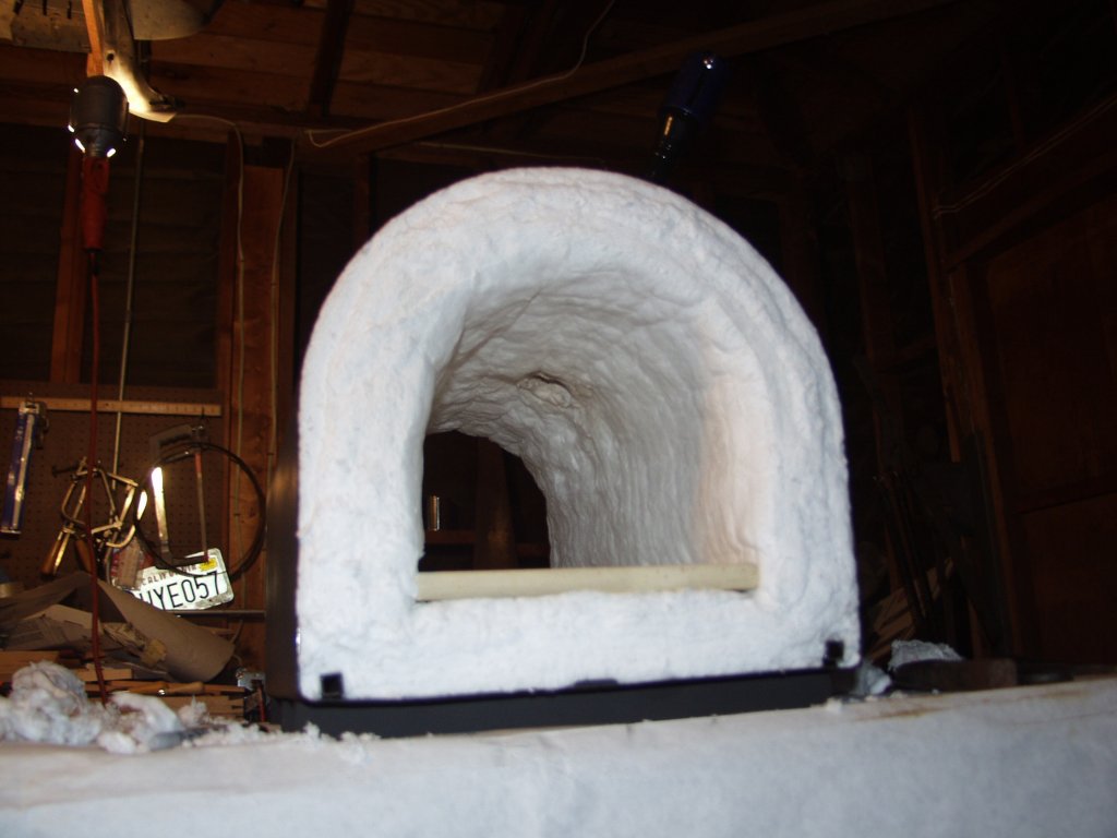 Forge building, a hole is created and enlarged for the burner to enter the forge, kept about 1