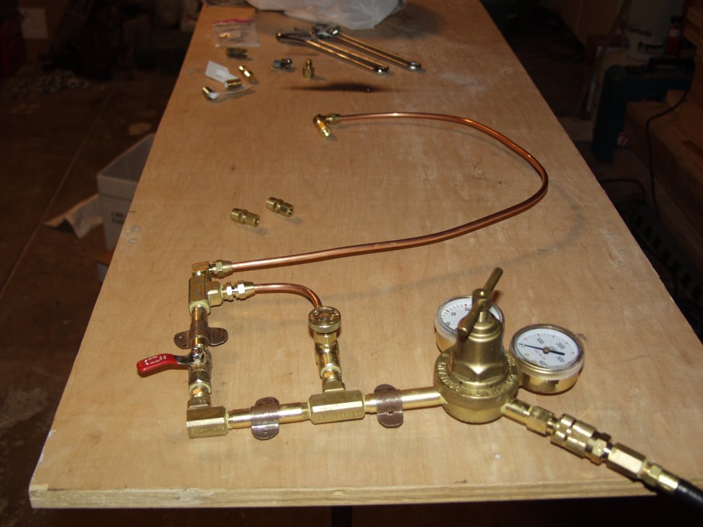 Here's a shot of the entire plumbing. This will mount on a sheet metal plate I folded at Ardenwood, which I'll paint black. I made the straps to hold it secure to the sheet metal plate as well. I measured and flared the piece of copper tubing I'll use to connect the burner. The flared fittings really fit nicely. I'm not sure why I see most forges with compression fittings, I hate those ring compression fittings...